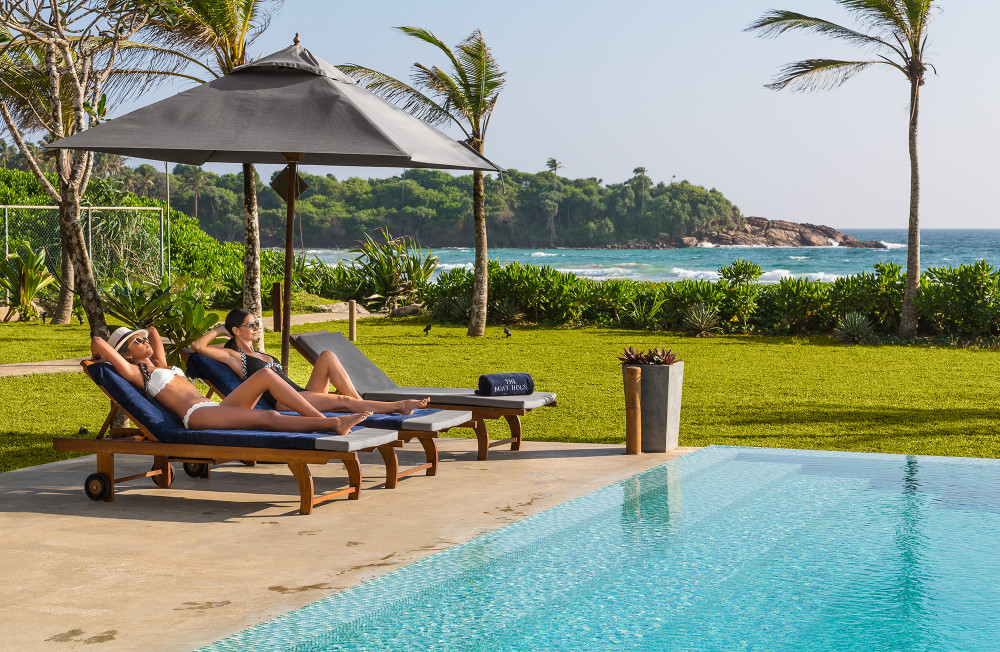 The pool and loungers at The Boat House, looking out over Dikwella Bay
