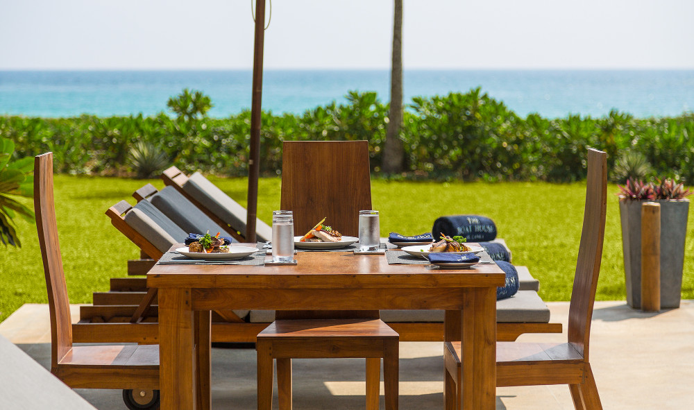 The terrace and dining table looking out to the sea